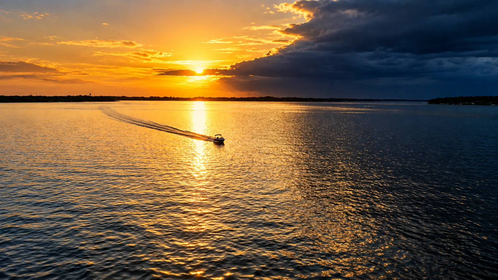 Storm light breaking over the open water of West Lake Okoboji, Iowa