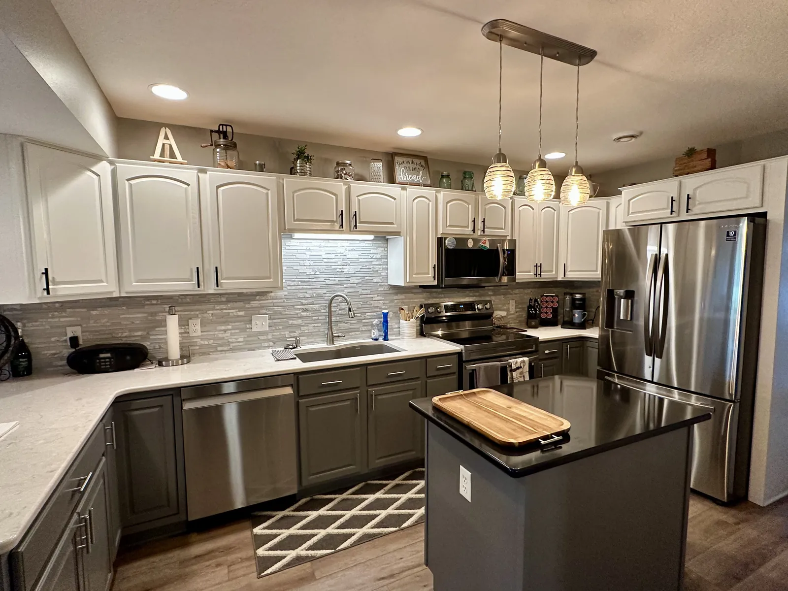 Updated kitchen with white cabinetry and quartz counters in an Okoboji, Iowa lake property