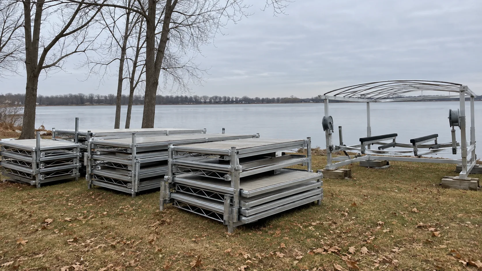 Dock sections and a boat lift stored on the shore for winter on an Okoboji, Iowa lake lot